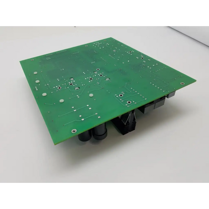 Green rectangular peak surgical dc power supply board mc-00147 rev 6 with silver solder pads and black cylindrical components on back
