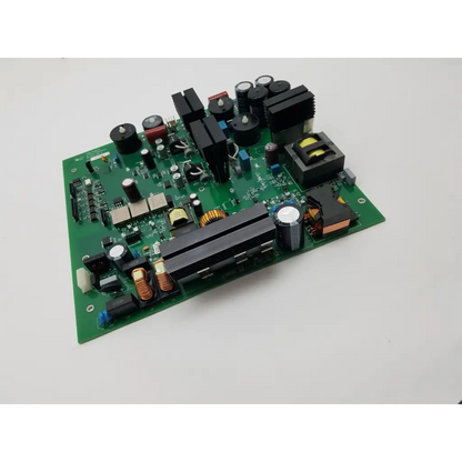 Green printed circuit board with black capacitors and copper coils in peak surgical dc power supply board mc-00147 rev 6
