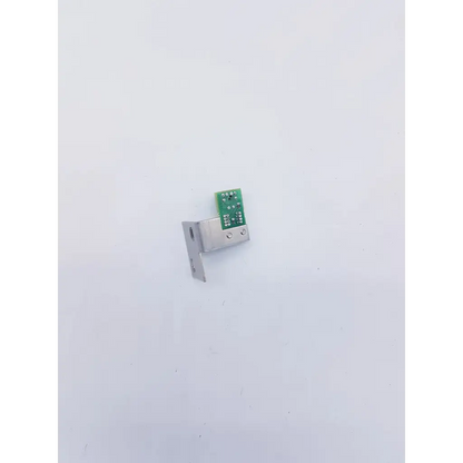 Silver metal bracket with green circuit board attached on perkinelmer precisely wizard2 optocoupler sensor txg 10865740