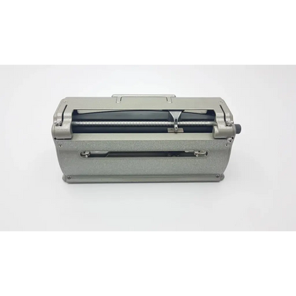 Silver metallic manual paper cutter with sturdy body and internal rollers for perkins classic brailler use