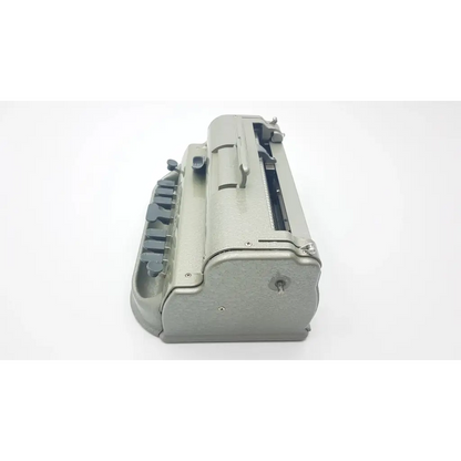 Gray metal perkins classic brailler with sturdy vintage design and black keys for braille writing by the blind