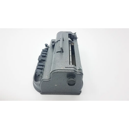 Gray speckled metal perkins classic brailler with black keys and visible internal components for blind howe press use