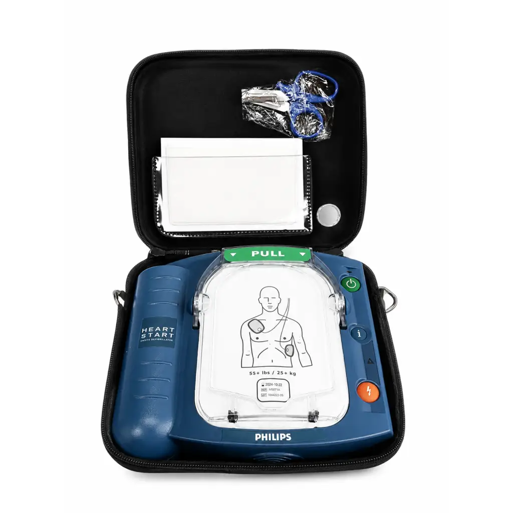 Blue philips onsite aed m5071a defibrillator complete kit in black case with pads and scissors for emergency use