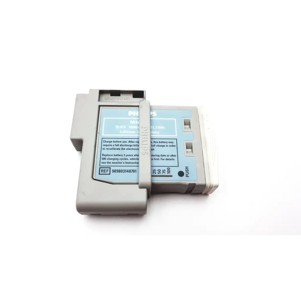 Gray philips intellivue m4607a mp2 battery module with light blue label and white plastic casing for patient monitor
