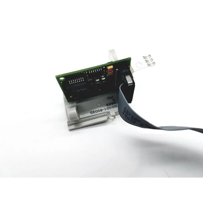Green circuit board with black components and gray ribbon cable on the back side of philips intellivue mp30 rear msl connector