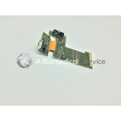 Green circuit board with black connectors and orange ribbon cable of philips intellivue mp70 m8071-67011 interface module