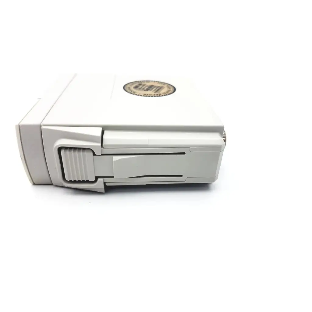 White plastic dji battery with circular label on top for philips m1002b ecg respiratory module