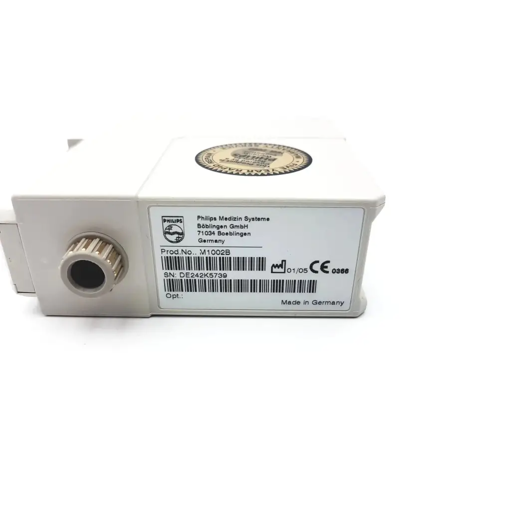 White rectangular philips m1002b ecg respiratory module with textured circular port and made in germany label on back side