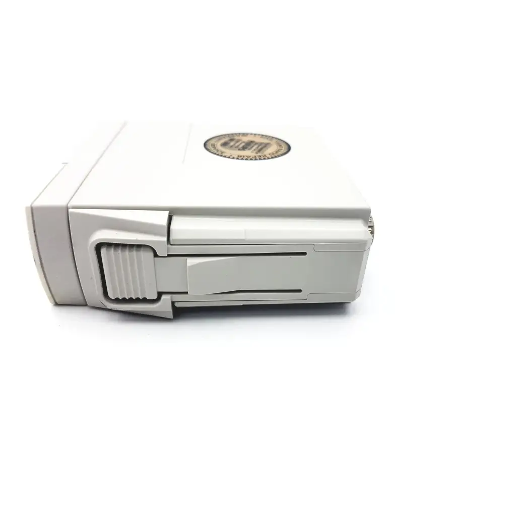 White plastic dji battery with circular label for philips m1002b ecg respiratory module back side view