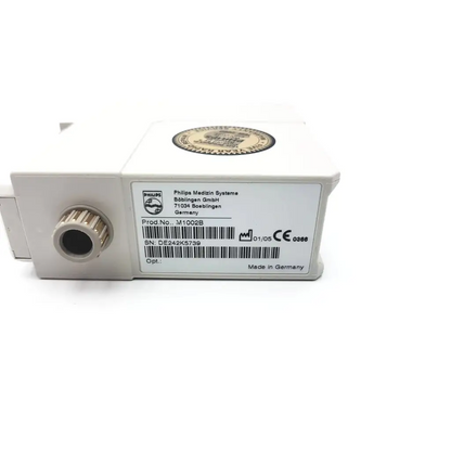 White rectangular philips m1002b ecg respiratory module with metallic port and gold seal made in germany