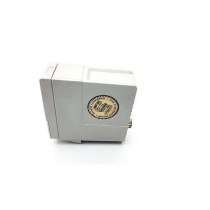 White rectangular Philips M1002B ECG respiratory module with circular gold label and small metal knob on side