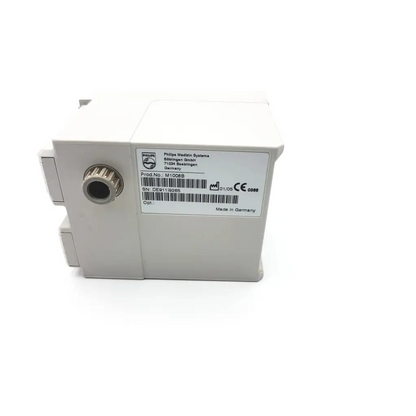 White rectangular philips m1008b nbp module with metallic threaded port and philips medison labeling visible