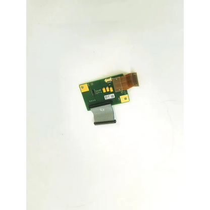 Green rectangular philips m3046-66442 circuit board with gold connectors and gray flexible ribbon cable attached