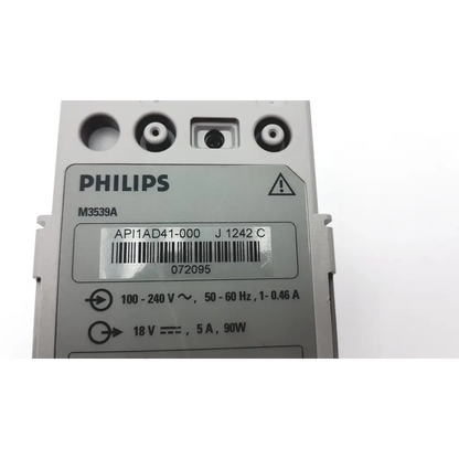 Gray philips m3539a heartstart mrx ac power adapter module showing label with technical specifications and barcode