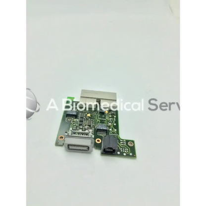 Green m8080-26401 intellivue mp60 circuit board with silver and black connectors and a rectangular metallic component