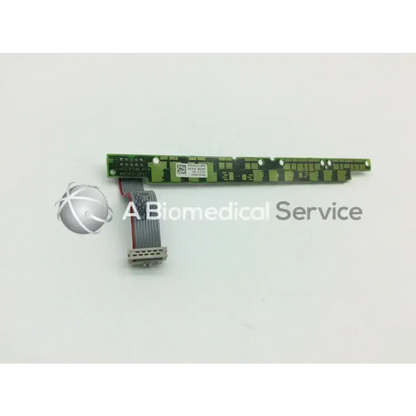 Green rectangular philips mp 70 m8065-66401 alarm board with gray ribbon cable and printed labels and component markings