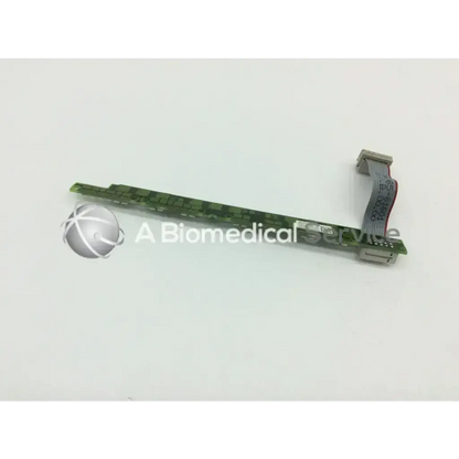 Green circuit board with flexible ribbon cable attached showing philips mp 70 alarm board m8065-66401 model