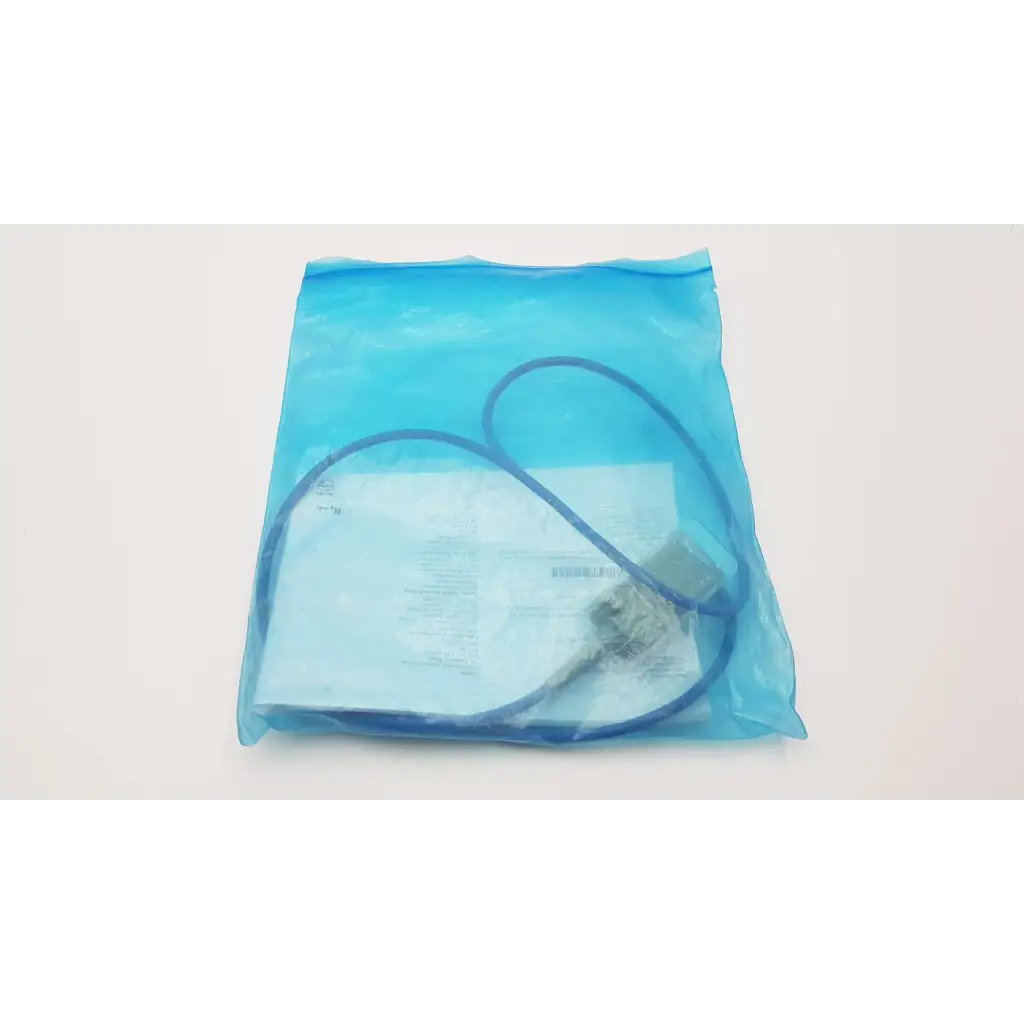 A blue plastic bag containing the philips ref m1943a sp02 adapter cable coiled with papers inside