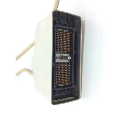 Off-white plastic housing with black interior and gold pins showing the back side of philips s7-2t omni tee transducer
