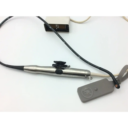 Silver metallic philips s7-2t omni tee transducer with black rubber grip and control buttons connected to flexible cable