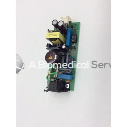 Green circuit board with black and blue components and yellow capacitors of phillips m3046-60002 power supply