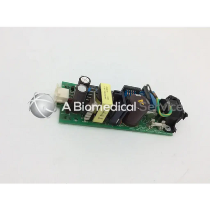 Green printed circuit board with black yellow and blue components of phillips m3046-60002 power supply unit