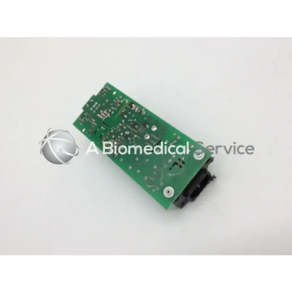 Green rectangular circuit board with silver soldered components and black connector for phillips m3046-60002 power supply
