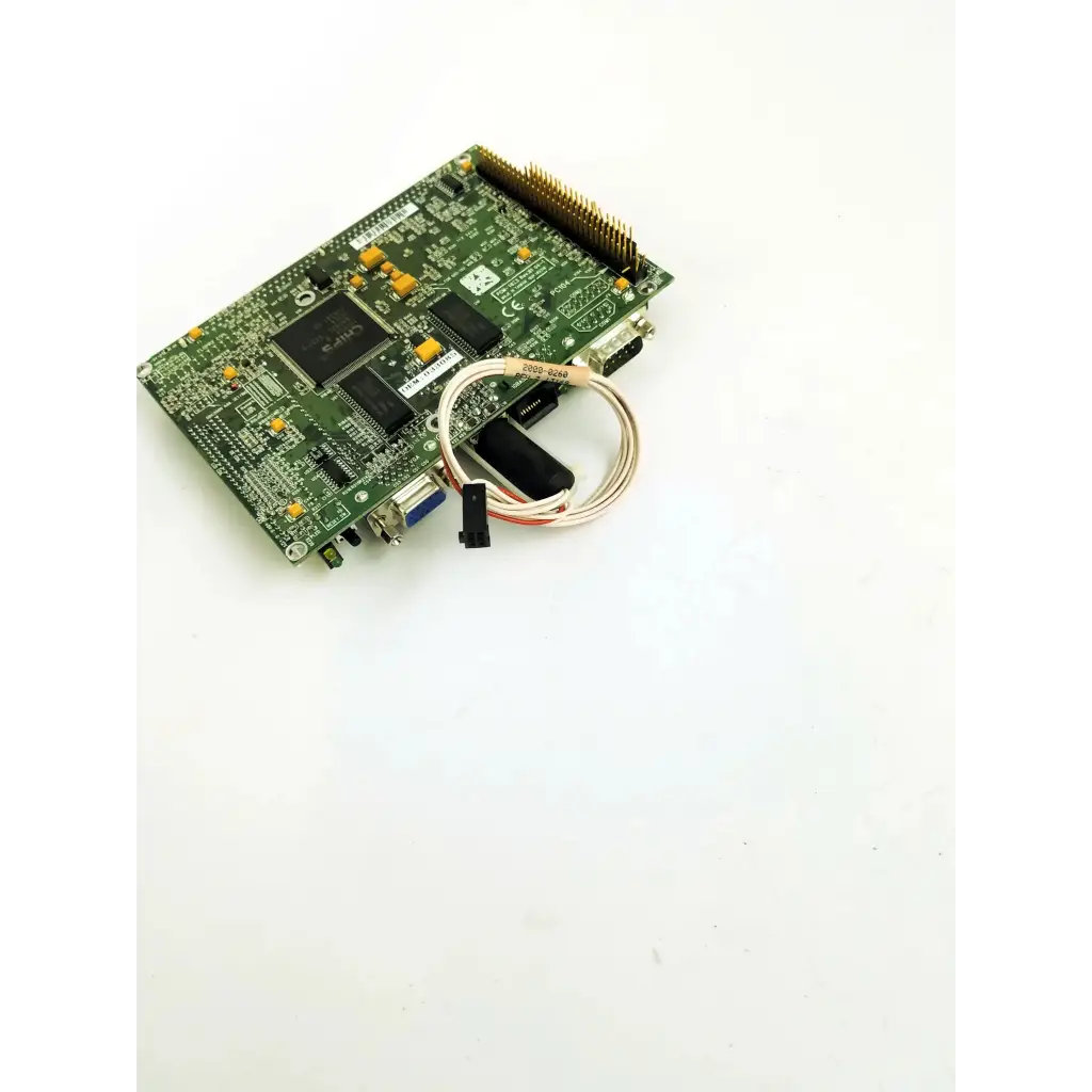Green phoenixbios d486 circuit board with black and yellow components and attached coiled cable for electronics use