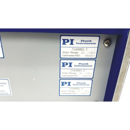 Gray metal panel with three blue and white pi physik instrumente labels showing calibrated lvpzt amplifier channels for servo controller