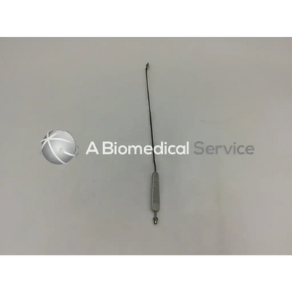 Silver metal spatula retractor adult left with textured handle and slender shaft for precise surgical use
