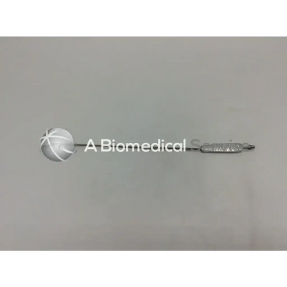 Silver spatula retractor adult left with spherical head cross-hatched grooves and textured handle in stainless steel