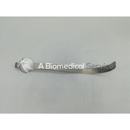 Silver metallic narrow deaver retractor with curved elongated body and engraved cross spherical end by pilling