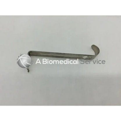 Silver surgical retractor with curved handle and spherical end cap for pilling 351671 multipurpose center blade use