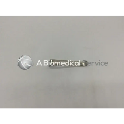 Silver metallic surgical multipurpose center blade with slender elongated body and rounded ends pilling 351671