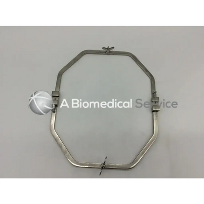 Silver octagonal surgical retractor with adjustable clamps and central pivot featuring teleflex deaver blade wexler and standard octagon frame