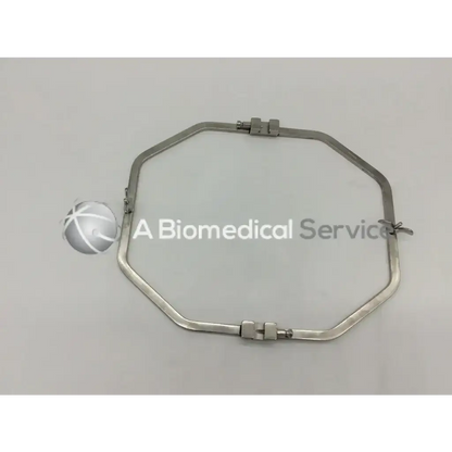 Silver metallic octagonal surgical retractor with adjustable clamps featuring teleflex deaver blade wexler and standard octagon frame
