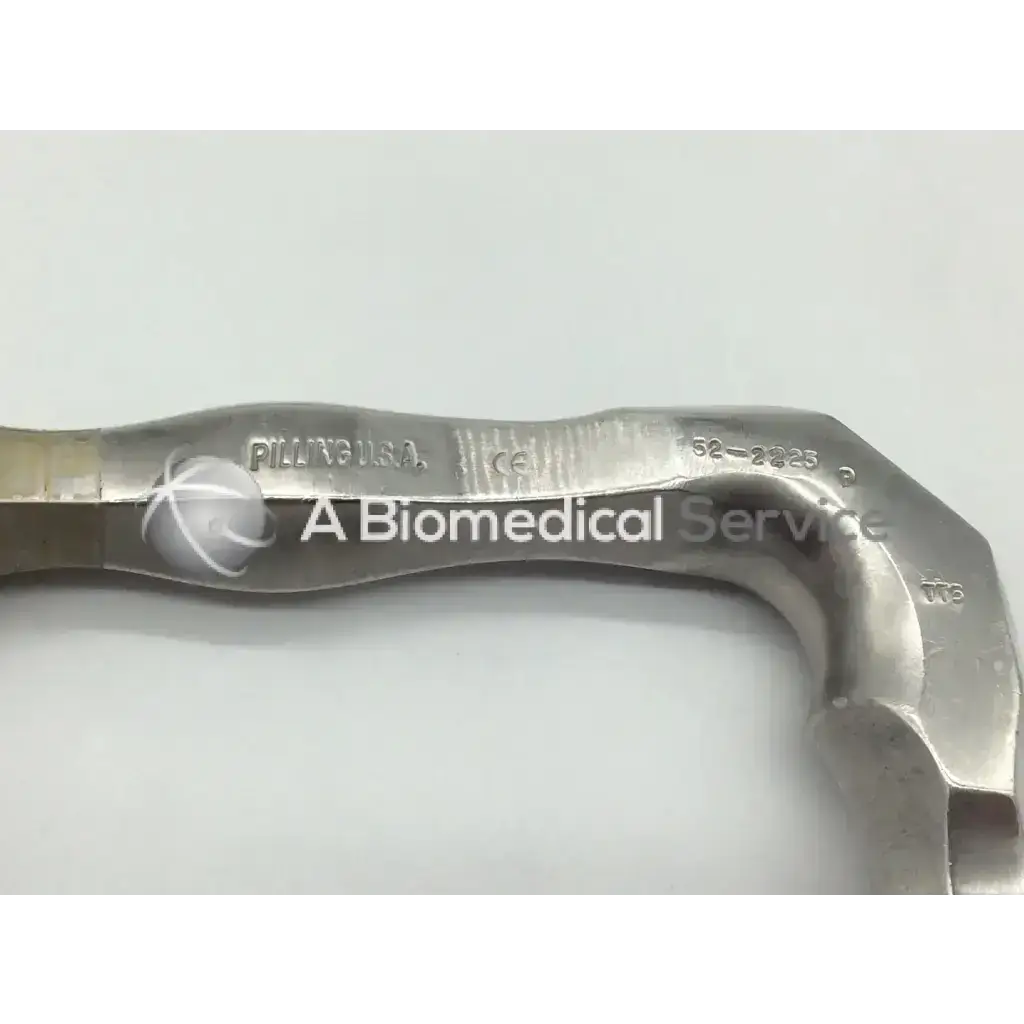 Silver metallic surgical micro adult laryngoscope with engraved markings and curved serrated edge from pilling 52-2225