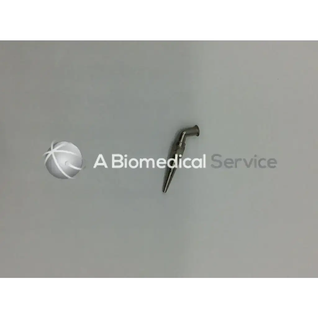 A metallic slender pilling stoney heparin injector with a curved handle and pointed tip for precise medical use