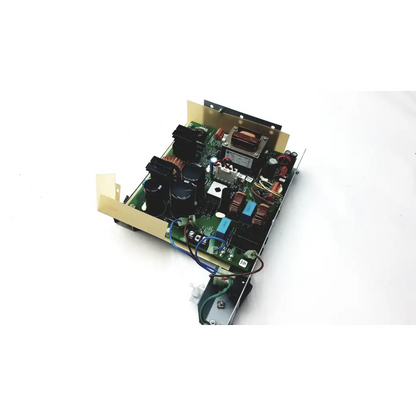 Green circuit board of planmeca intra psu2 with black capacitors blue and red wires and metallic transformer
