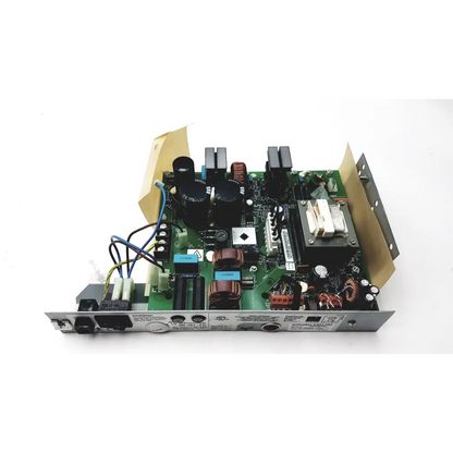 Green circuit board with black capacitors copper coils and silver components of planmeca intra psu2 power supply unit