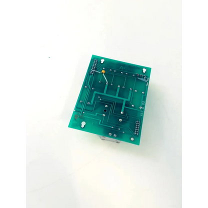 Green rectangular pneutronics valve module bbcb2-12 circuit board with silver soldered components and yellow wire