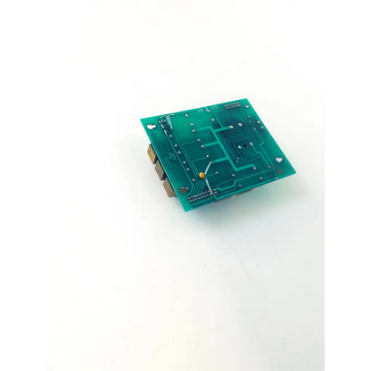 Green rectangular printed circuit board valve module bbcb2-12 with copper traces soldered components and yellow capacitor