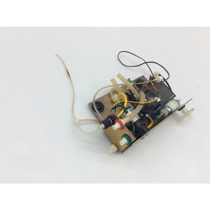 A compact beige 12vdc psi solenoid valve pneumotronics 990-000278-004 with complex wiring and mechanical components