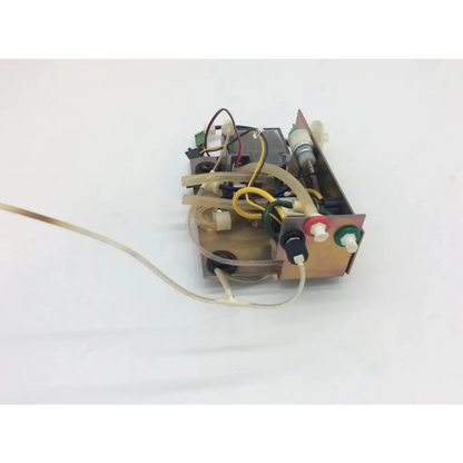 Metallic rectangular pneutronics 990-000278-004 12vdc 10 psi solenoid valve with exposed wiring and colored connectors