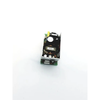 Silver metallic power condor gpm41-15 power supply 15vdc with black components and green circuit board