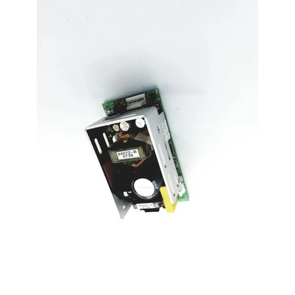 Silver metallic power condor power supply 15vdc with green circuit board and visible internal components