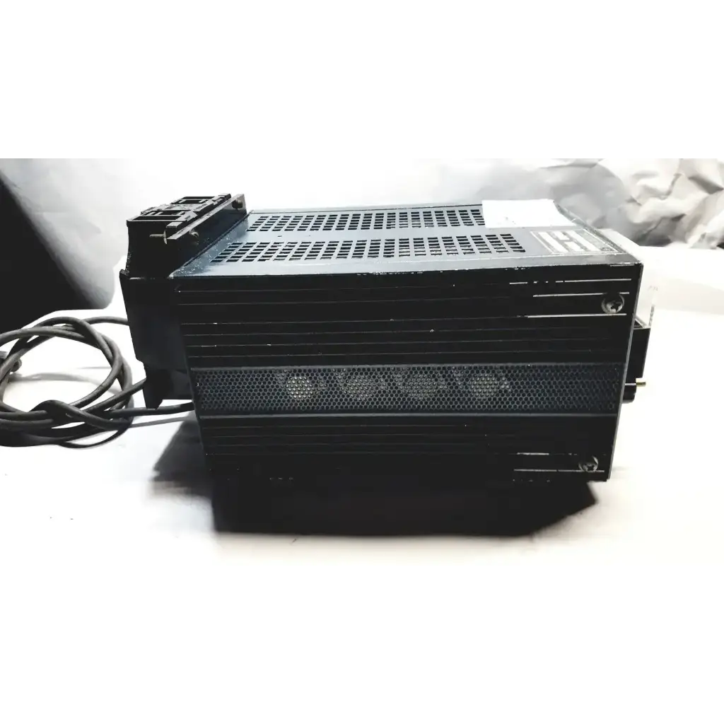 Black rectangular power supply with perforated ventilation and coiled power cord by power mate corp 105-125v