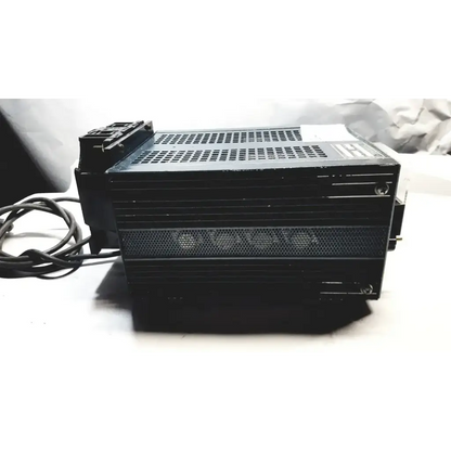 Black rectangular power supply with perforated ventilation and coiled power cord by power mate corp 105-125v