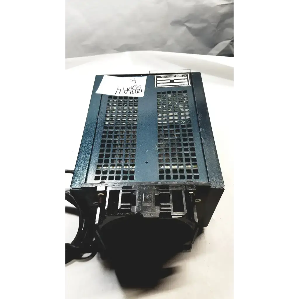 Black metal power supply unit with grid-patterned vent and labeled stickers from power mate corp 105-125v 47-20hz