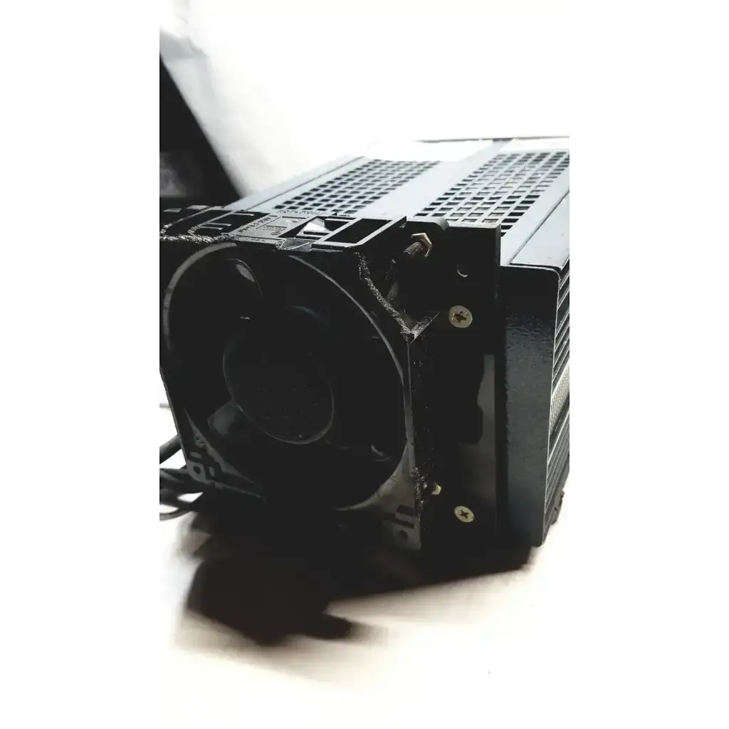 Black rectangular computer cooling fan with mesh grille and screws mounted on power mate corp power supply 105-125v chassis
